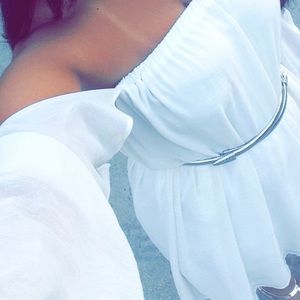 White dress with sleeves that go off the shoulder